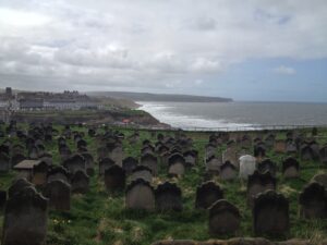 A photograph of Whitby Abbey graveyard
